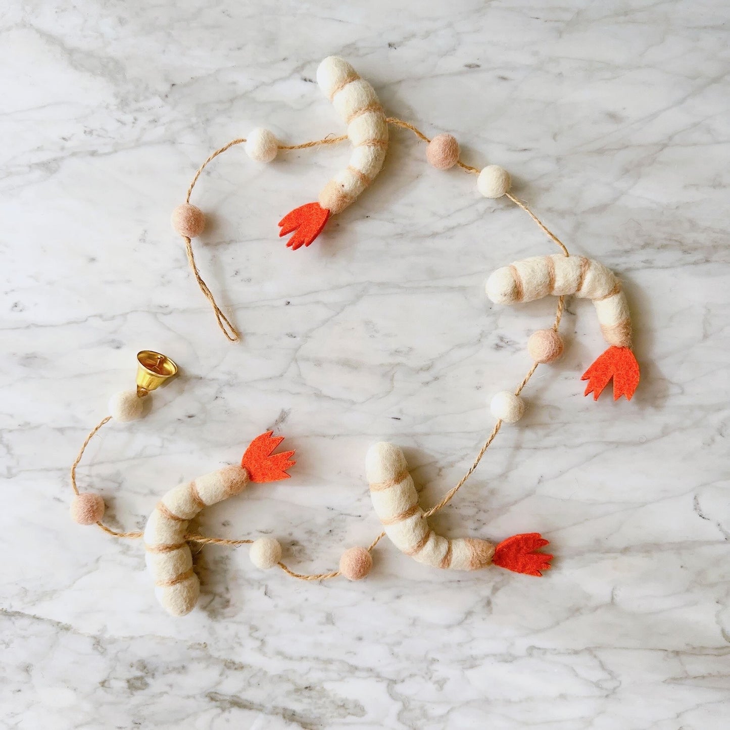 Elevate your holiday decor with our charming handmade felt garland, meticulously crafted by Ganapati Crafts Co.. Infuse your festivities with elegance as this garland drapes gracefully, adding a touch of festive spirit to your Christmas celebrations.