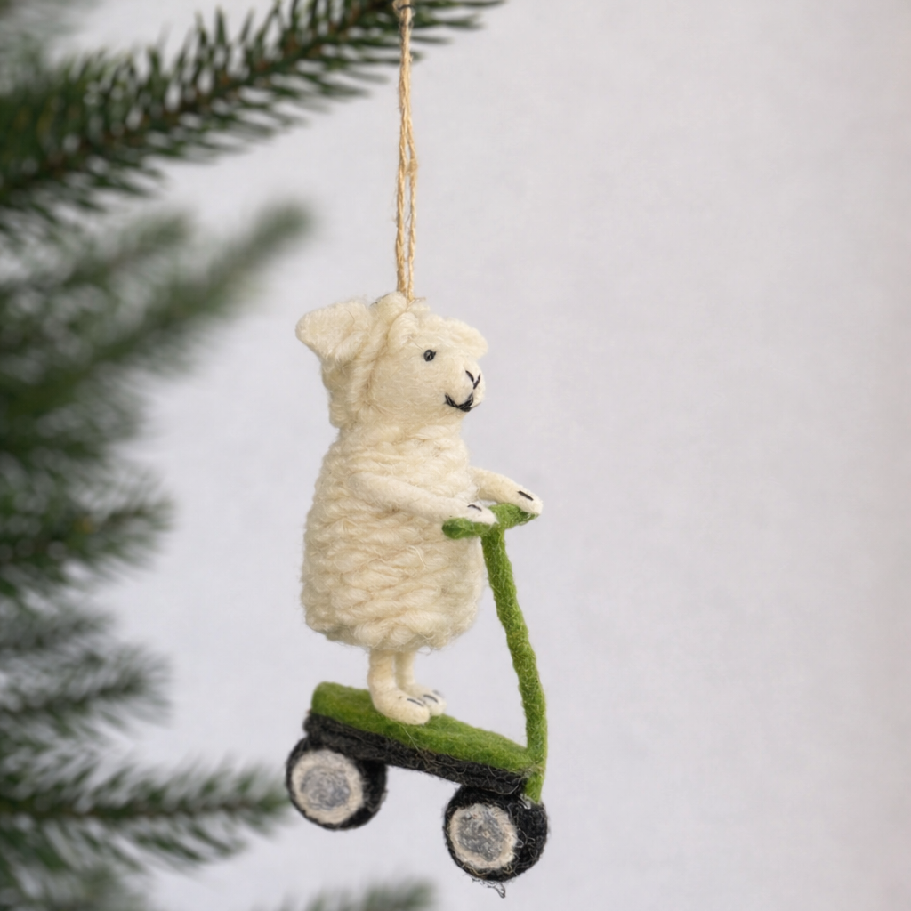 sheep on a green scooter