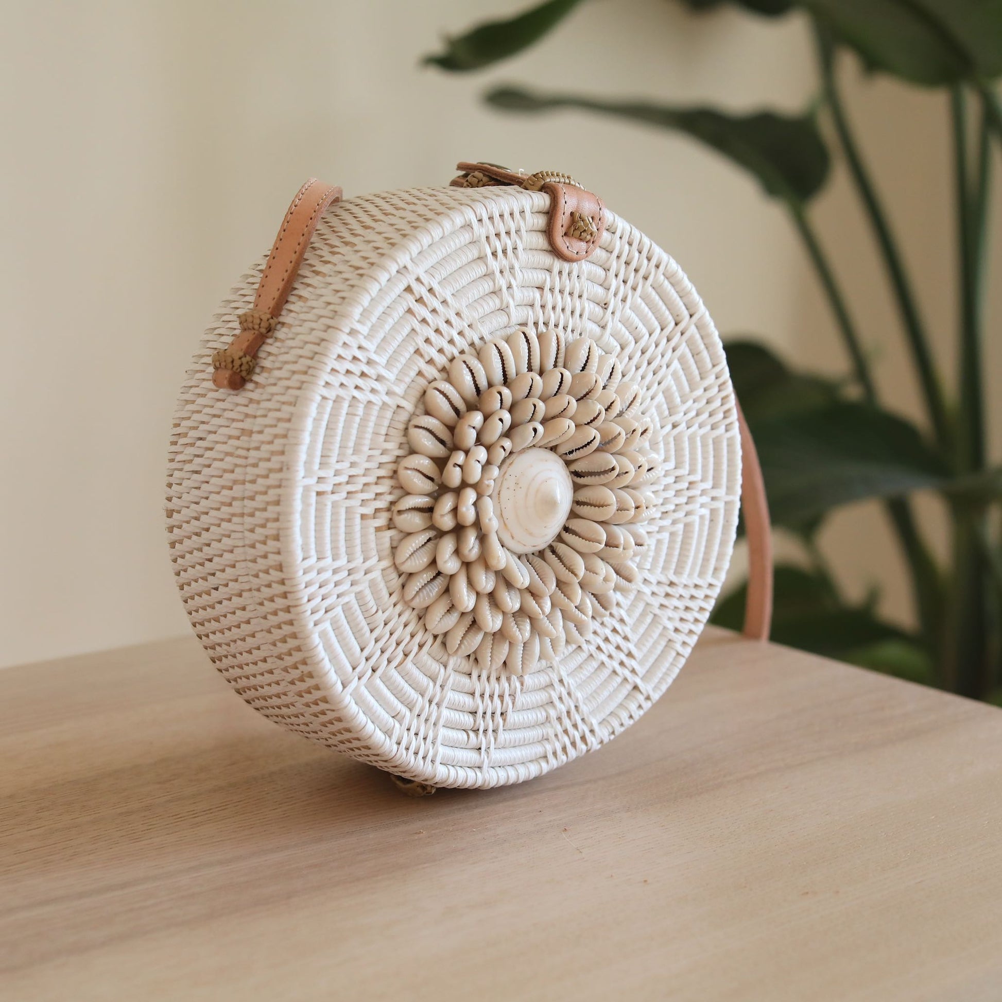 White Bali Round Rattan Bag with Seashell Embellishment. Handmade in Bali by Ganapati Crafts Co.