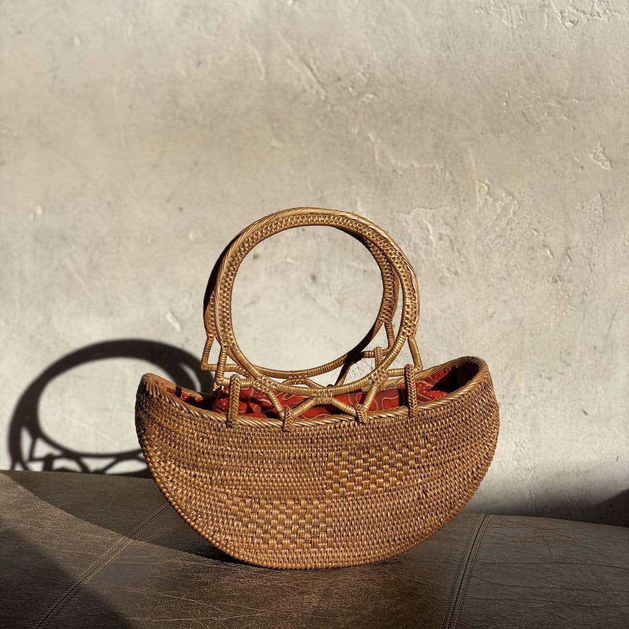 Bali Rattan Boat Clutch handmade by Ganapati Crafts Co. in Bali is the perfect accessory for any stylish woman